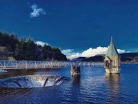 a bridge over a lake in scotland