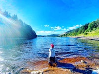 a man is fishing in a river